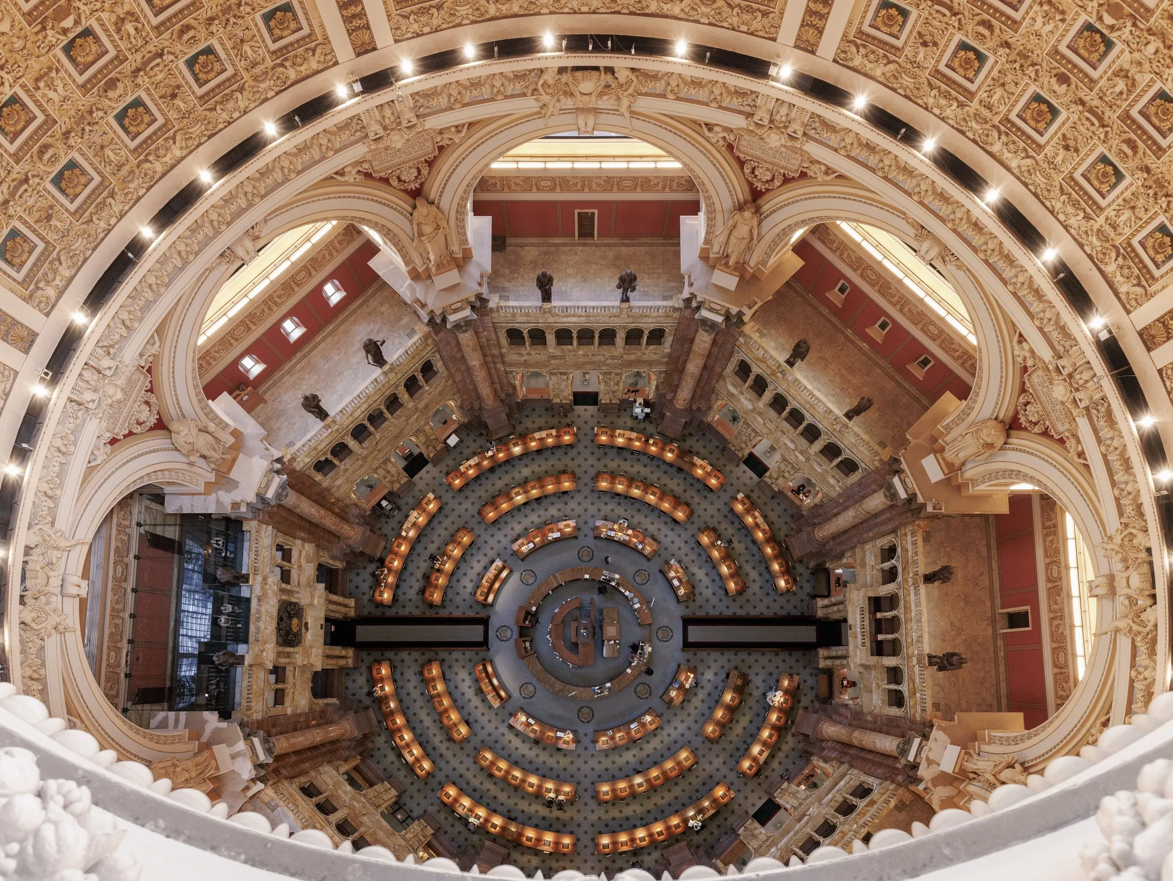 The United States Capitol dome beneath an American flag.